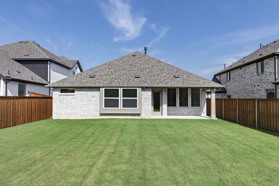Exterior details and patio area of a home in The Reserve at Spiritas Ranch, Little Elm (Image 4).