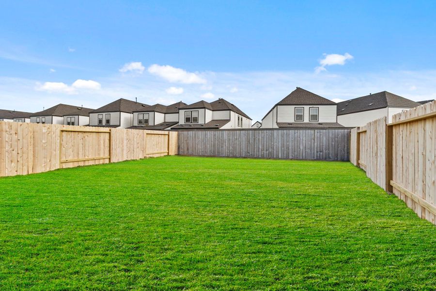 Exterior details and patio area of a home in Grand West, Houston (Image 15).