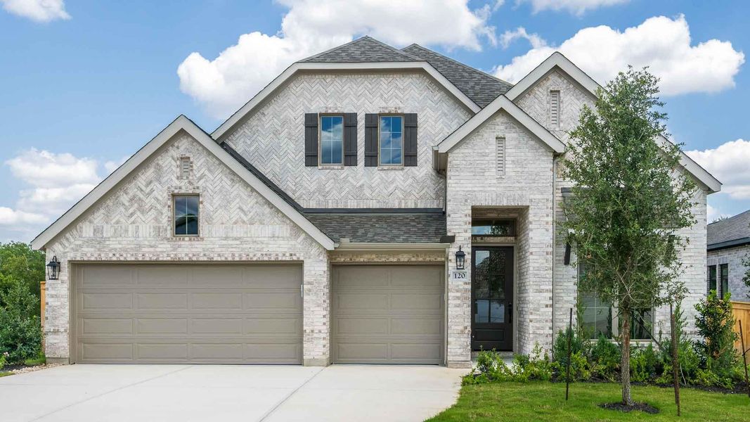 French country style house with concrete driveway, roof with shingles, and an attached garage French country style house with concrete driveway, roof with shingles, and an attached garage