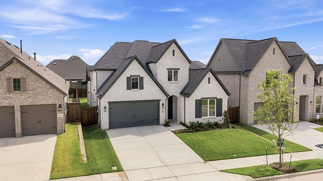 Front exterior of a new home in Tavolo Park, Fort Worth, TX, highlighting curb appeal (Image 24).