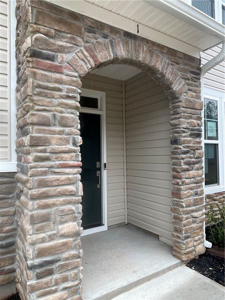 Exterior details and patio area of a home in Springwood Grove, Central (Image 3).
