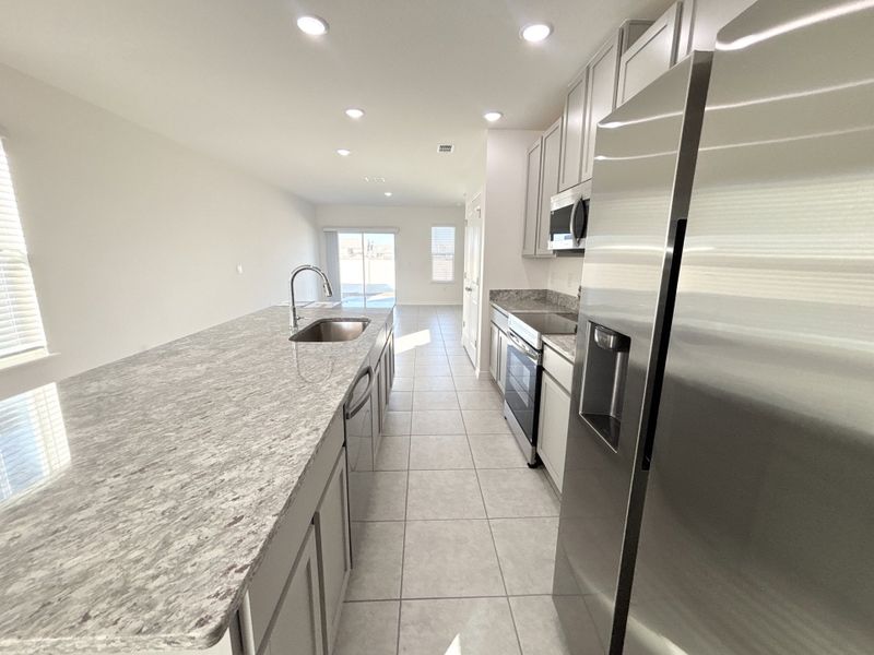 Furnished interior view inside a new home in Lake Deer Estates, Poinciana (Image 6).