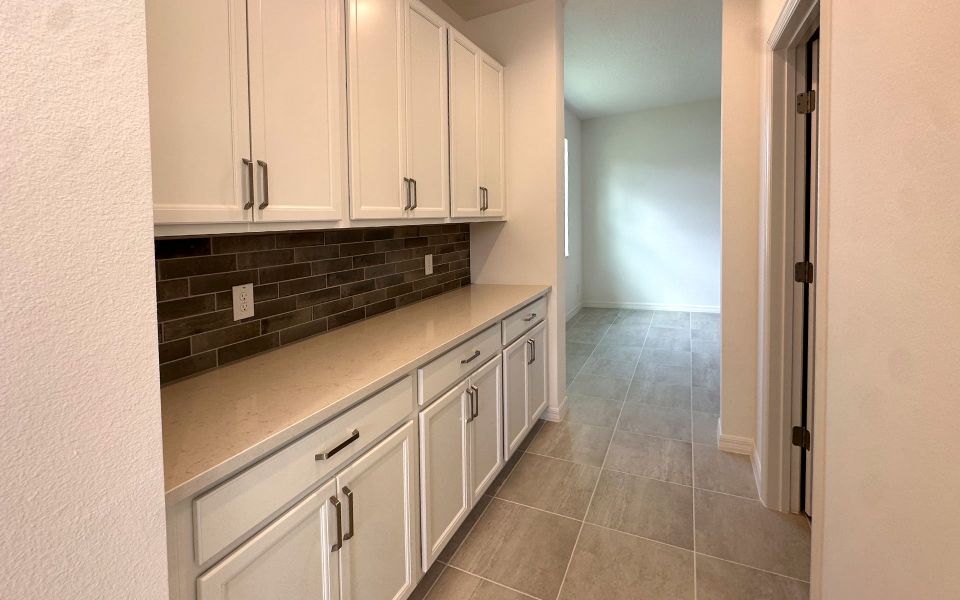Furnished interior view inside a new home in Trinity Gardens, Deland (Image 5).