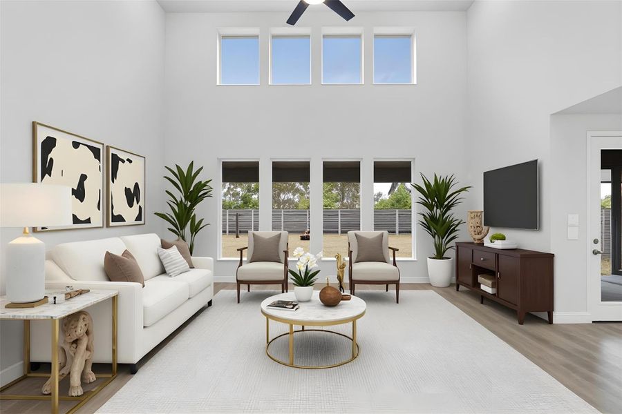 Enjoy the open and airy Family Room, designed for seamless entertaining and showcasing striking architectural details with high ceilings, durable laminate flooring, and a wall of windows bringing in an abundance of natural light! *Virtually Staged Enjoy the open and airy Family Room, designed for seamless entertaining and showcasing striking architectural details with high ceilings, durable laminate flooring, and a wall of windows bringing in an abundance of natural light! *Virtually Staged
