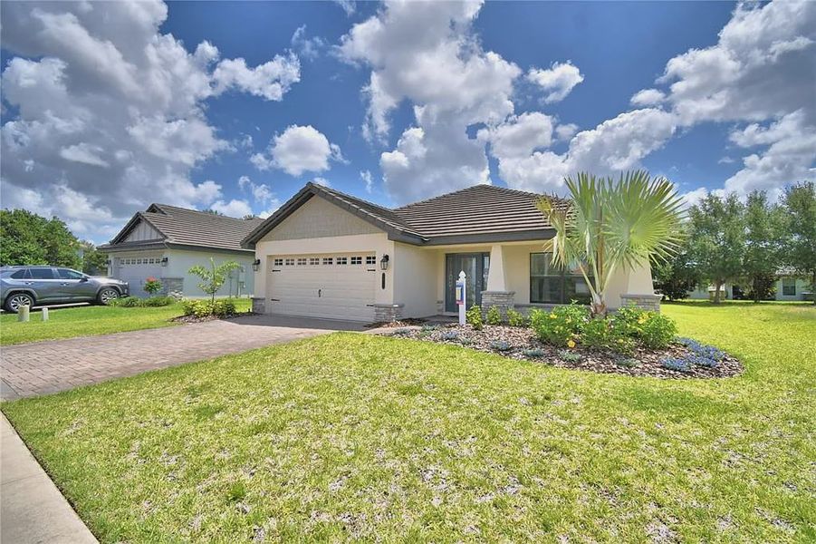 Front exterior of a new home in Lake Juliana Estates, Auburndale, FL, highlighting curb appeal (Image 26).