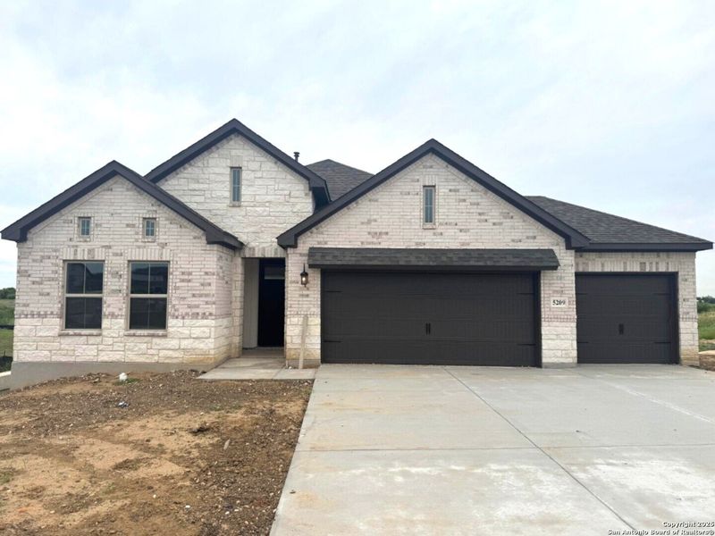 Front exterior of a new home in The Parklands, Schertz, TX, highlighting curb appeal (Image 1). Front exterior of a new home in The Parklands, Schertz, TX, highlighting curb appeal (Image 1).