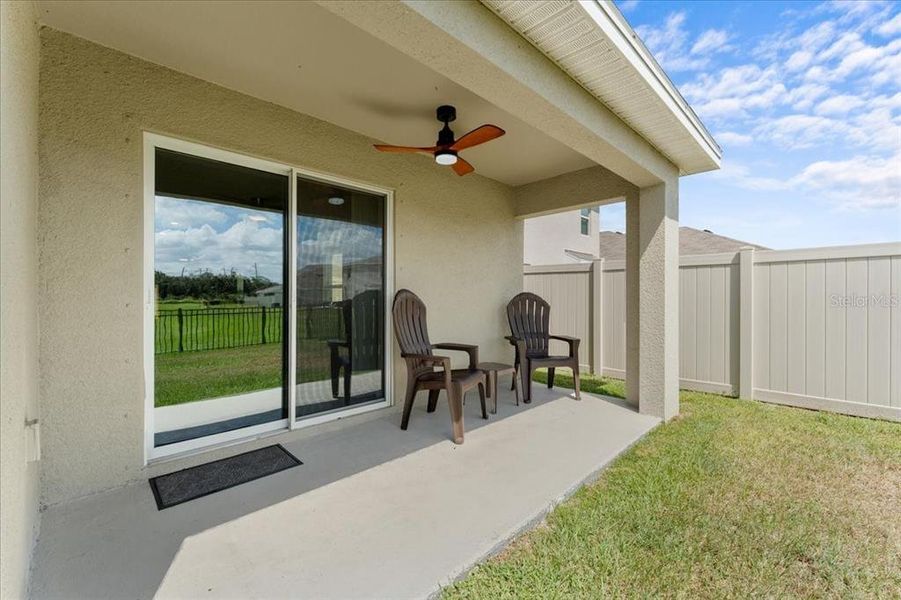 Exterior details and patio area of a home in Bella Lago, Parrish (Image 20).