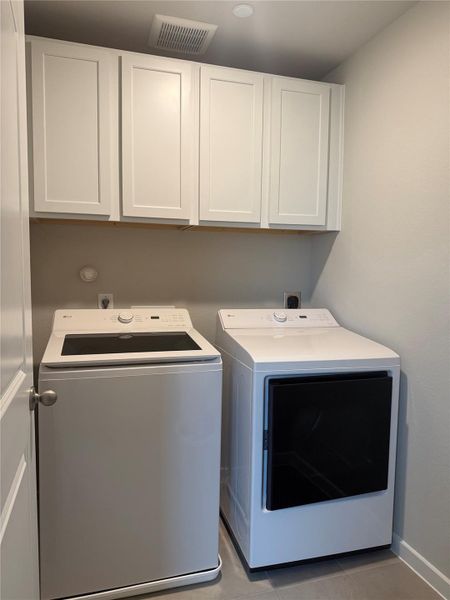 Upstairs laundry room makes it convenient to do everyday tasks. Appliances are included.