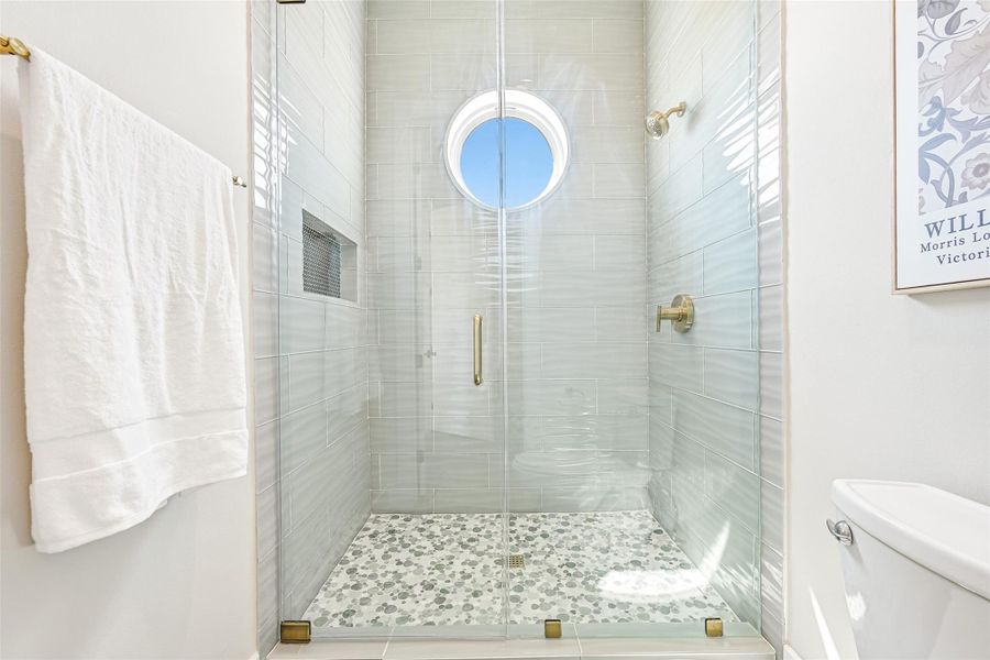 Step inside and feel the calm of sunlight spilling through the circular window. The enclosed shower becomes your private sanctuary for relaxation, rejuvenation, and coastal-inspired living.