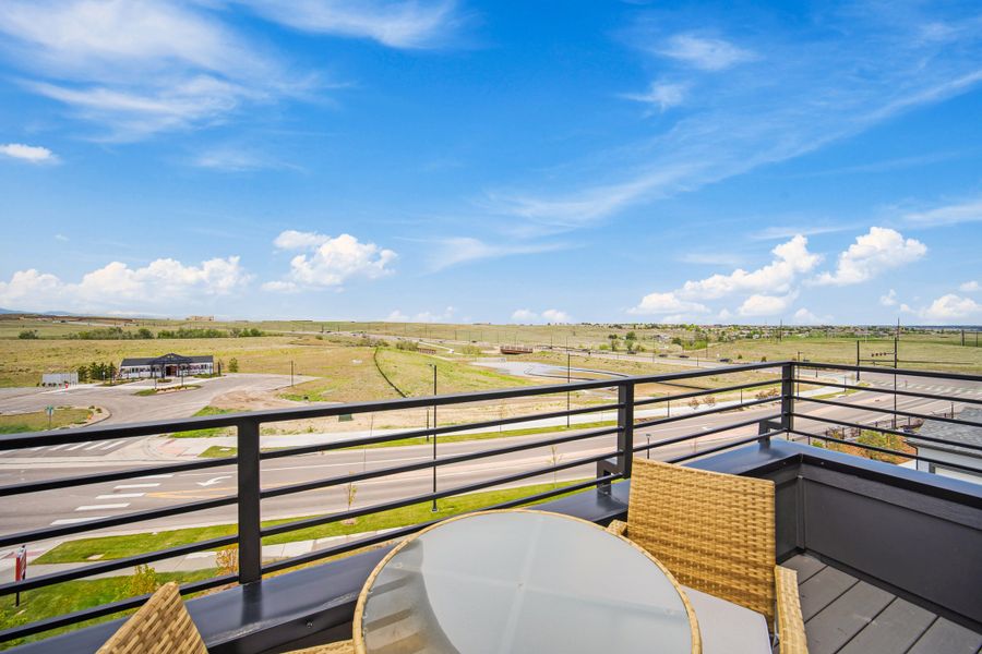 Exterior details and patio area of a home in Lyric at RidgeGate Condos, Lone Tree (Image 3).