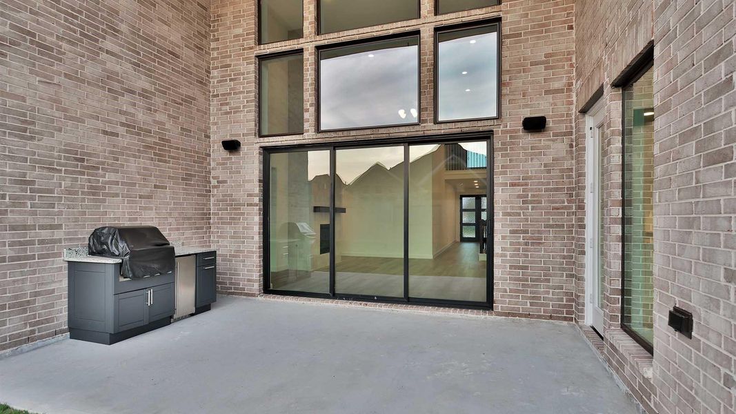 Exterior details and patio area of a home in Candela South 60', Richmond (Image 3).