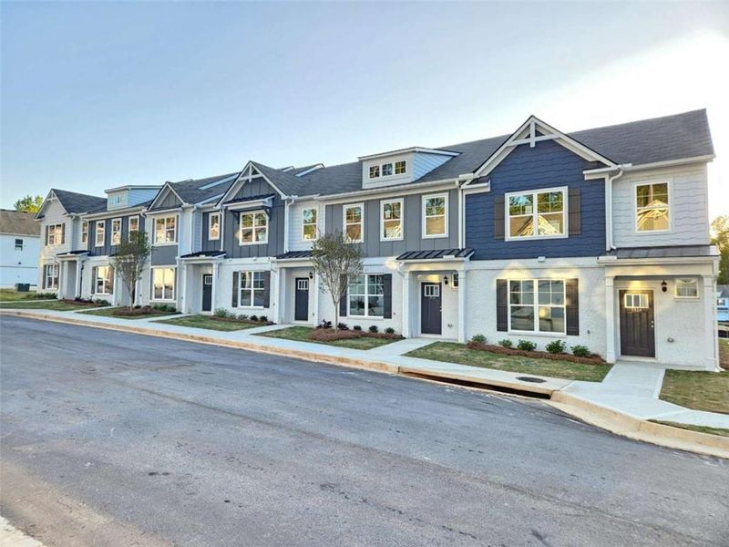 Front exterior of a new home in , Conyers, GA, highlighting curb appeal (Image 1). Front exterior of a new home in , Conyers, GA, highlighting curb appeal (Image 1).