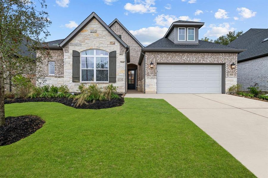 The Mcavoy is a beautiful 4-bedroom 1 story brick home in Tomball!