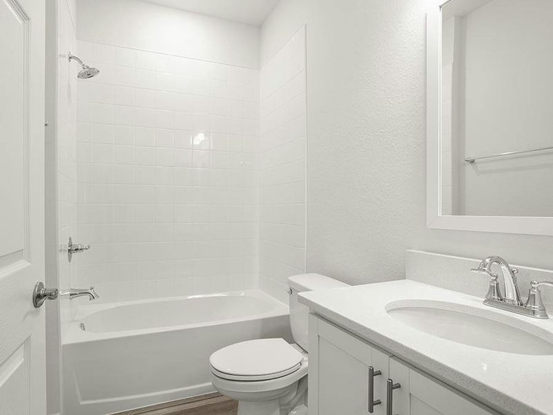 Secondary bedrooms share a hall bath, and a powder room is available for your guests. Secondary bedrooms share a hall bath, and a powder room is available for your guests.