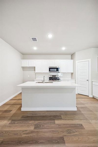 Kitchen in the Willow home plan by Trophy Signature Homes – REPRESENTATIVE PHOTO