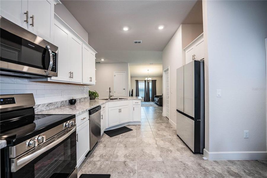 Furnished interior view inside a new home in , Winter Haven (Image 27).