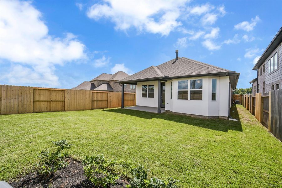Exterior details and patio area of a home in Sienna 40', Missouri City (Image 3). Exterior details and patio area of a home in Sienna 40', Missouri City (Image 3).