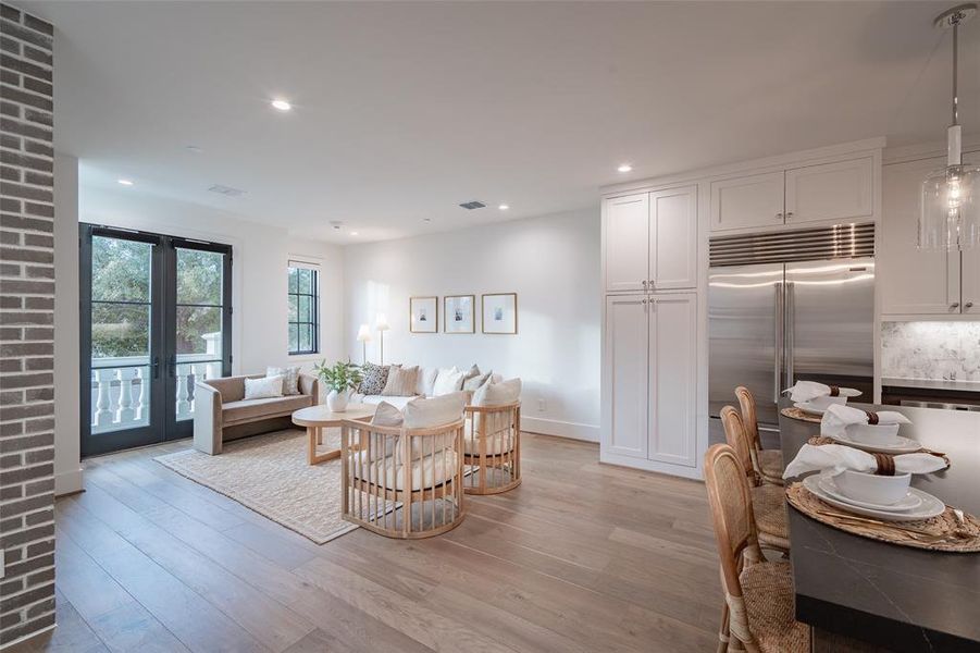 Living room featuring french doors and light hardwood / wood-style flooring