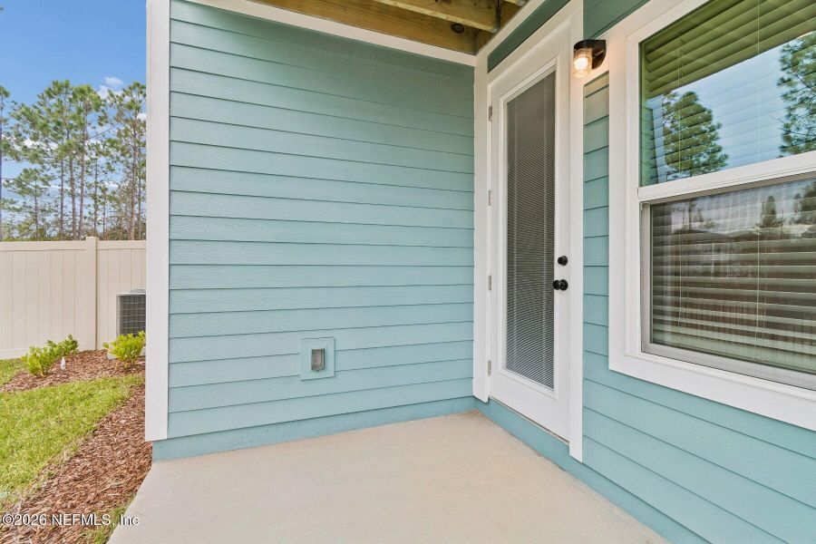 Exterior details and patio area of a home in Kettering at eTown - Paired Villas, Jacksonville (Image 18). Exterior details and patio area of a home in Kettering at eTown - Paired Villas, Jacksonville (Image 18).