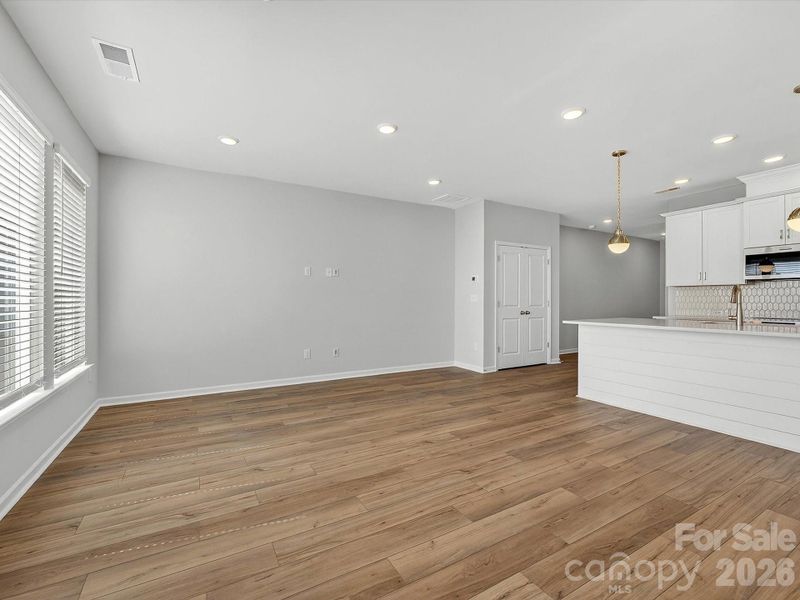 Open, bright living room with LVP flooring