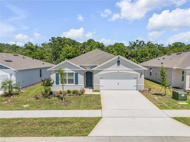 Front exterior of a new home in , New Smyrna Beach, FL, highlighting curb appeal (Image 31).