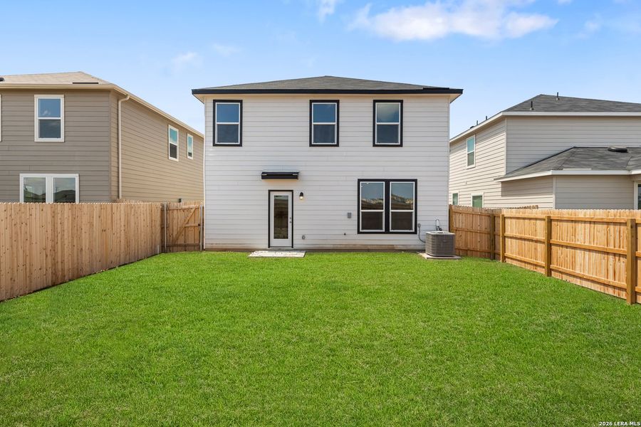 Exterior details and patio area of a home in Medina Crossing, Von Ormy (Image 23).