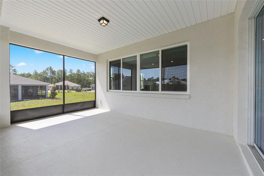 Exterior details and patio area of a home in On Top of the World Communities, Ocala (Image 4).