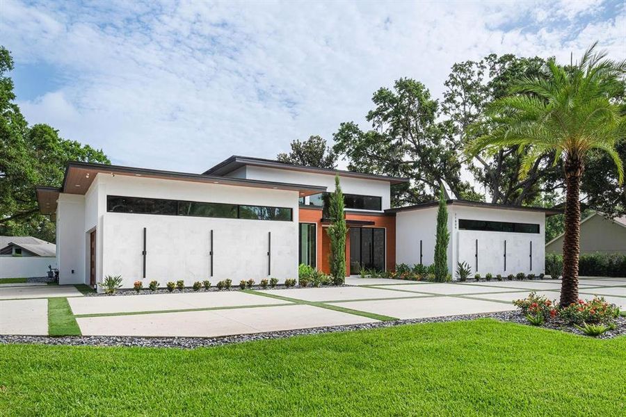 Front exterior of a new home in , Windermere, FL, highlighting curb appeal (Image 2). Front exterior of a new home in , Windermere, FL, highlighting curb appeal (Image 2).