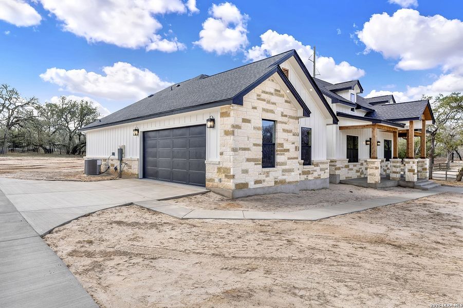 Front exterior of a new home in , La Vernia, TX, highlighting curb appeal (Image 27).