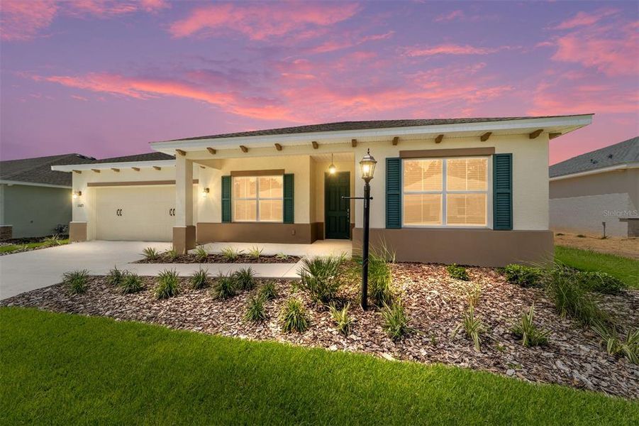 Front exterior of a new home in On Top of the World Communities, Ocala, FL, highlighting curb appeal (Image 17).