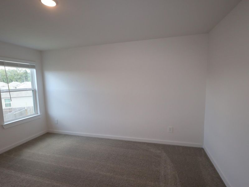 Spacious, unfurnished interior of a new home in Pinewood at Grand Texas, New Caney (Image 28).