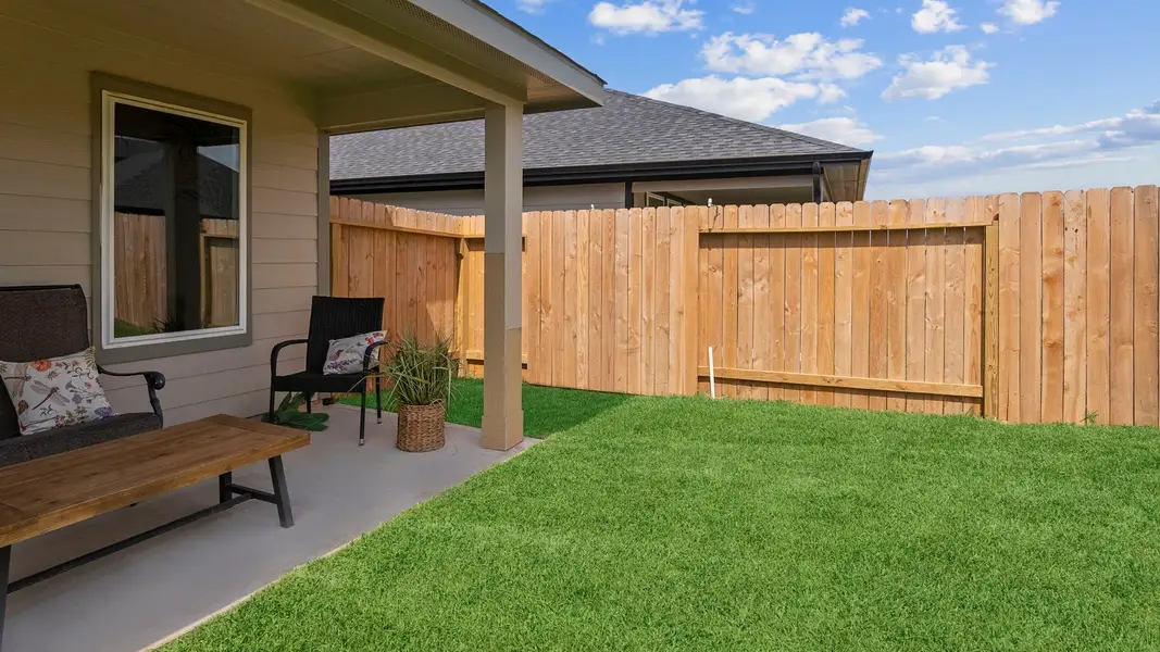 Exterior details and patio area of a home in Emberly, Beasley (Image 2).