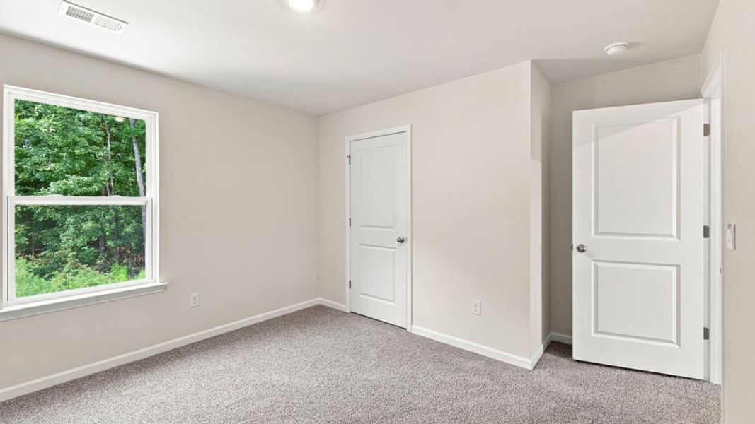 Spacious, unfurnished interior of a new home in Bentley Park, Greenwood (Image 28).
