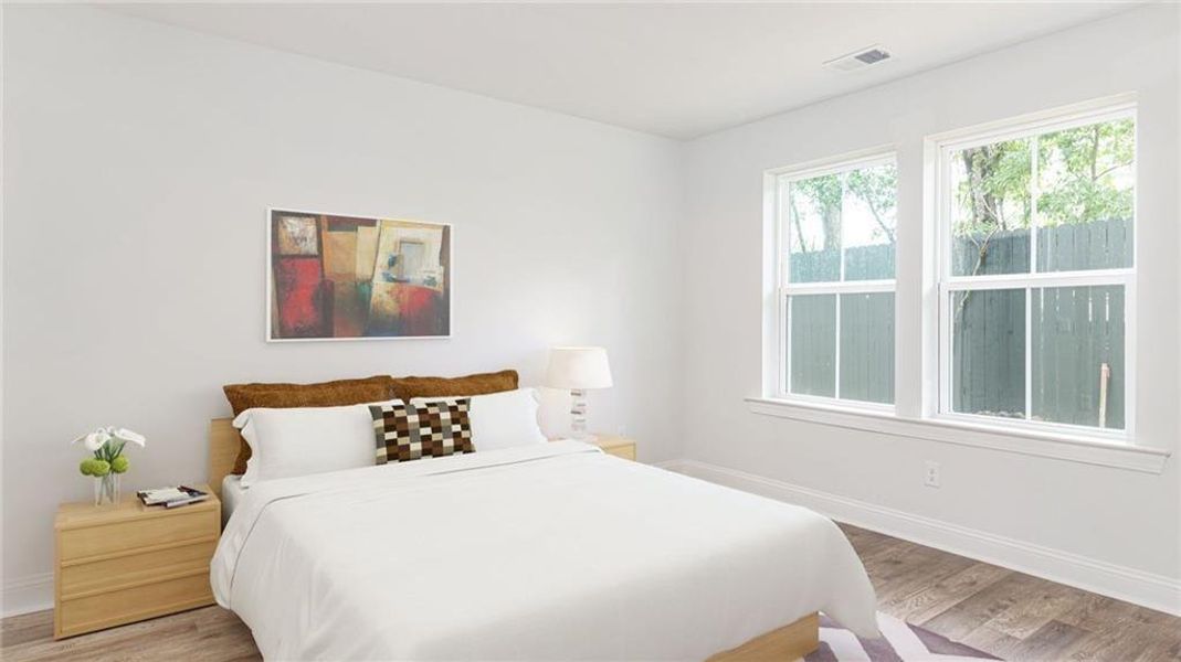 Bedroom with light hardwood / wood-style floors