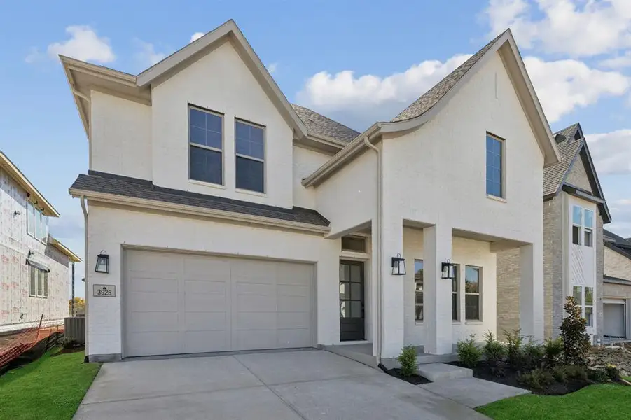 Featuring beautiful white brick with complimentary trim, lovely gables and gentle curves, this dream home offers outstanding curb appeal!