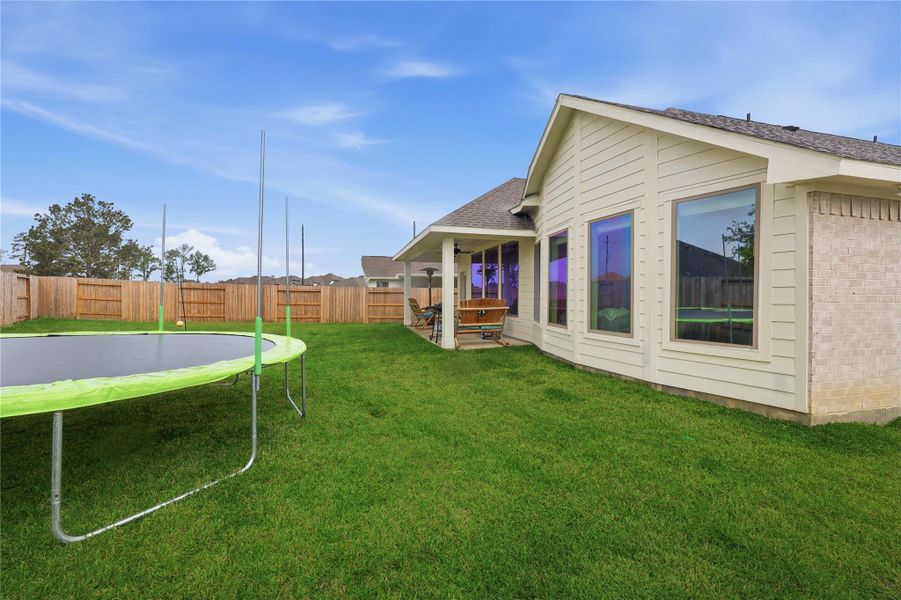 Exterior details and patio area of a home in , Spring (Image 4).