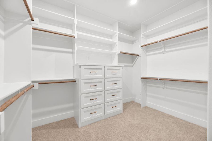 Walk in closet with light carpet Walk in closet with light carpet