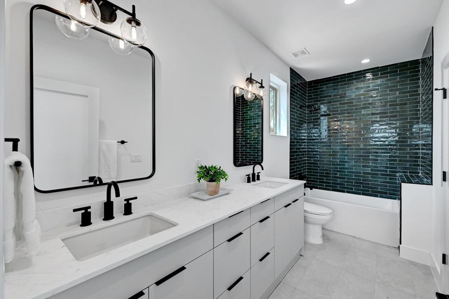 Full bathroom featuring double vanity