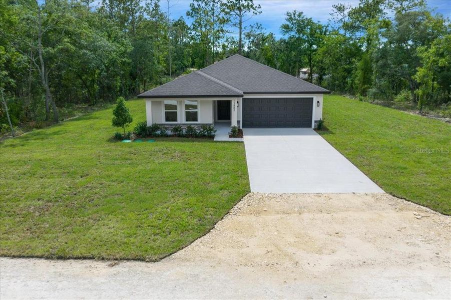 Front exterior of a new home in , Brooksville, FL, highlighting curb appeal (Image 32). Front exterior of a new home in , Brooksville, FL, highlighting curb appeal (Image 32).