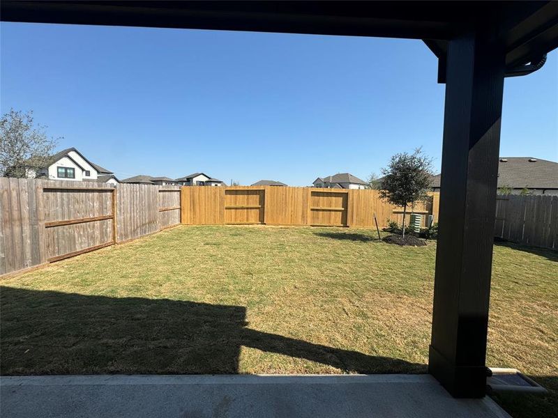 Deep backyard with huge back covered patio with gas line and  pre plumbing for a full future outdoor kitchen.