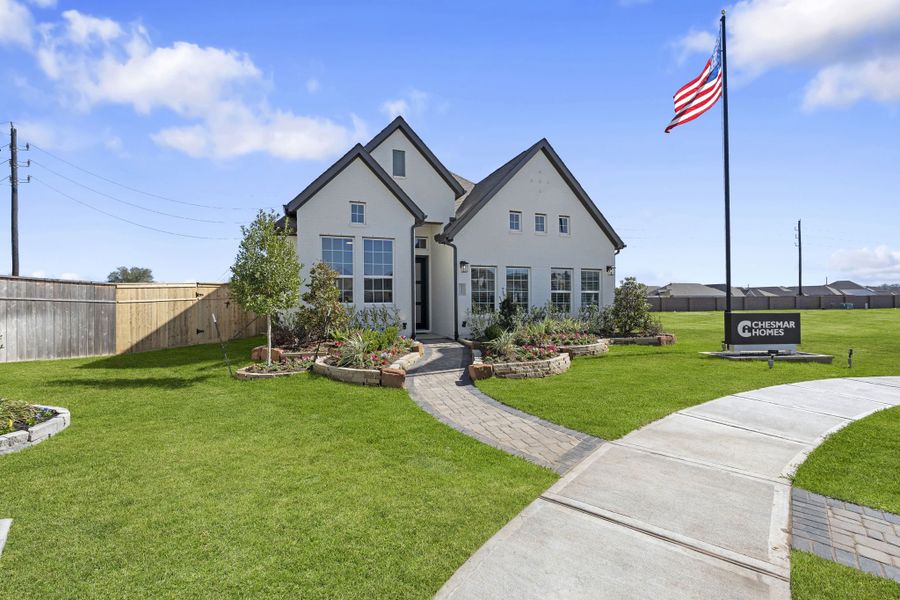 Front exterior of a new home in Brookewater, Rosenberg, TX, highlighting curb appeal (Image 22).