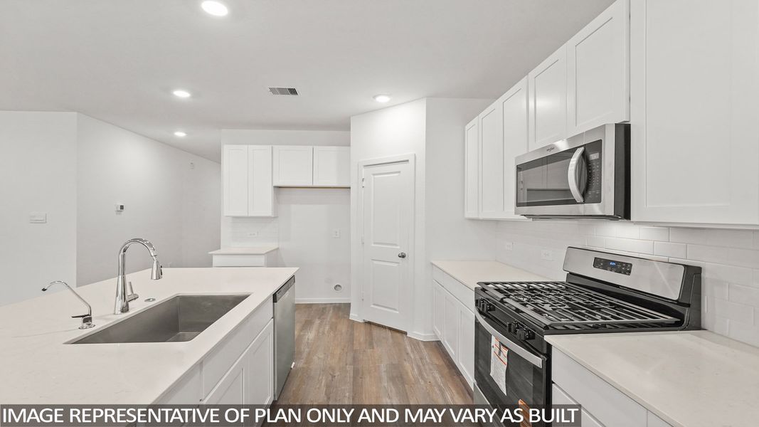 Furnished interior view inside a new home in Sunterra, Katy (Image 5).