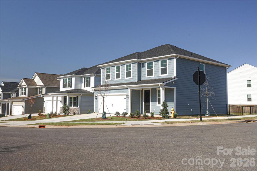 Front exterior of a new home in , Denver, NC, highlighting curb appeal (Image 19).