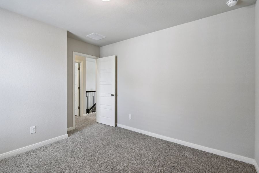 Guest bedroom in the Medina floorplan at a Meritage Homes community.