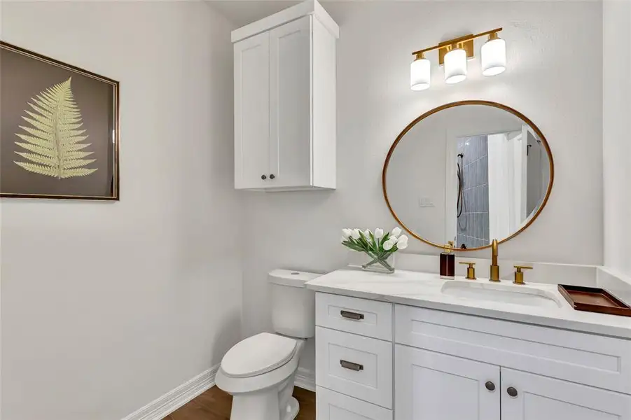 Downstairs powder room for convenient guest access.