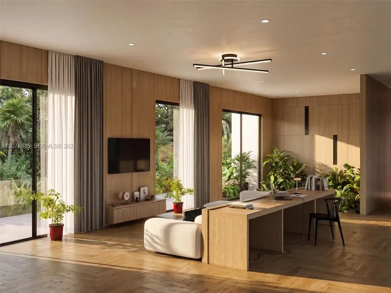 Open living and kitchen area with modern finishes, natural light, and seamless indoor-outdoor flow.