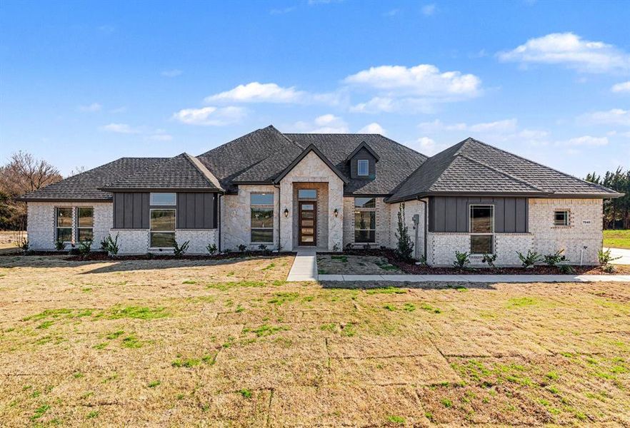 Front exterior of a new home in Sagebrush Addition, Midlothian, TX, highlighting curb appeal (Image 20).