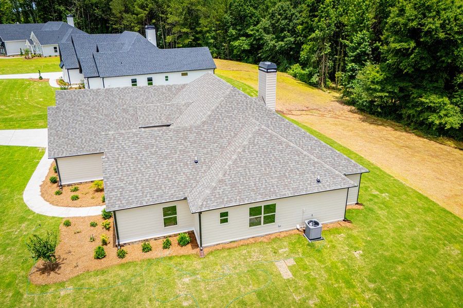Exterior details and patio area of a home in WOODMONT RESERVE, Roopville (Image 3).