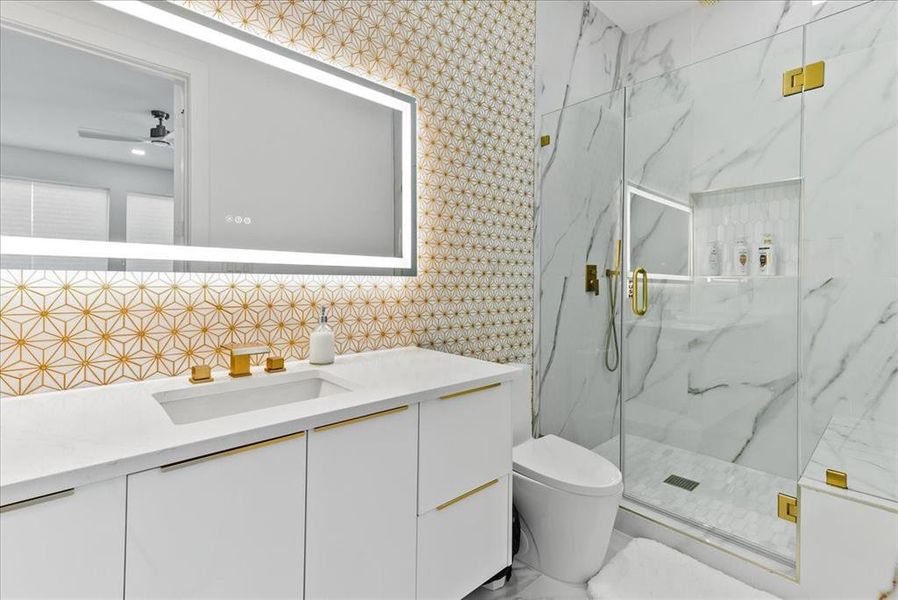 Bathroom featuring porcelain, and enclosed shower