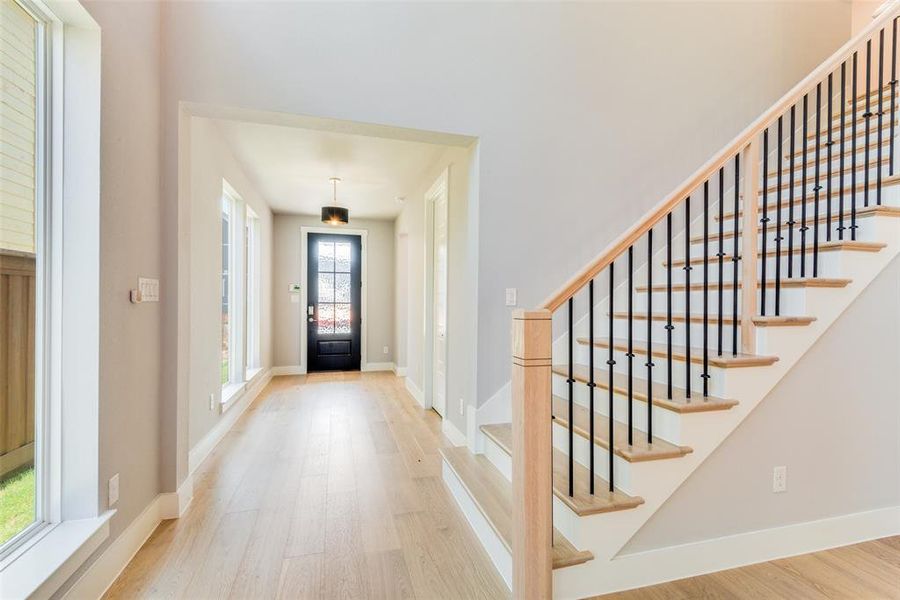 Foyer featuring wood-type flooring